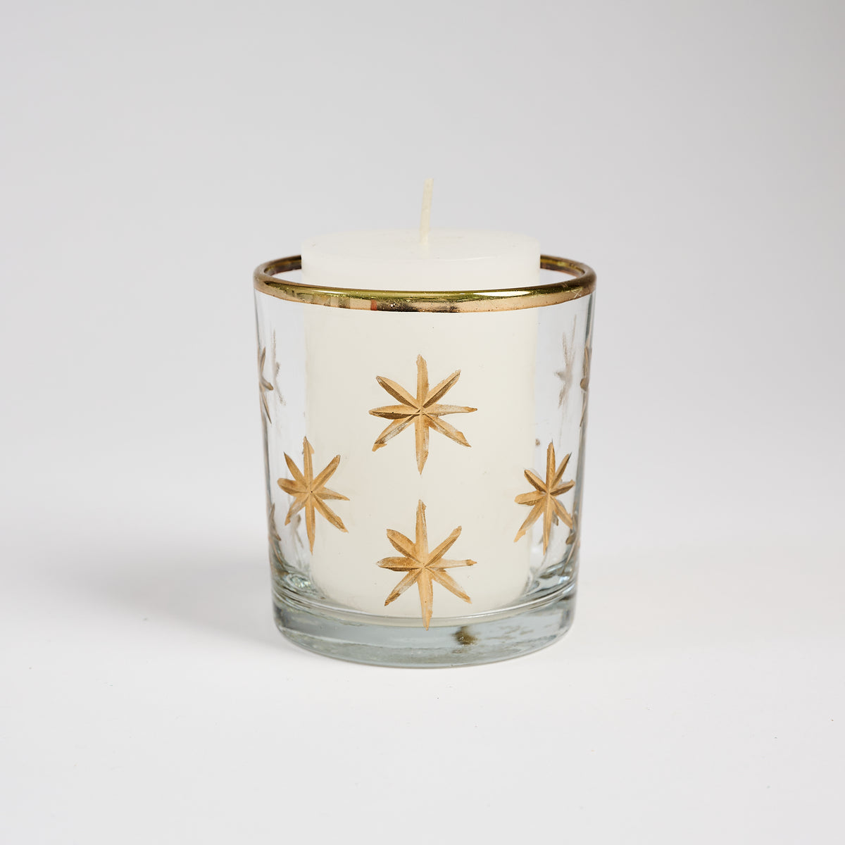 Stars Gold Etched Tealight Holder on a white background at Addison West