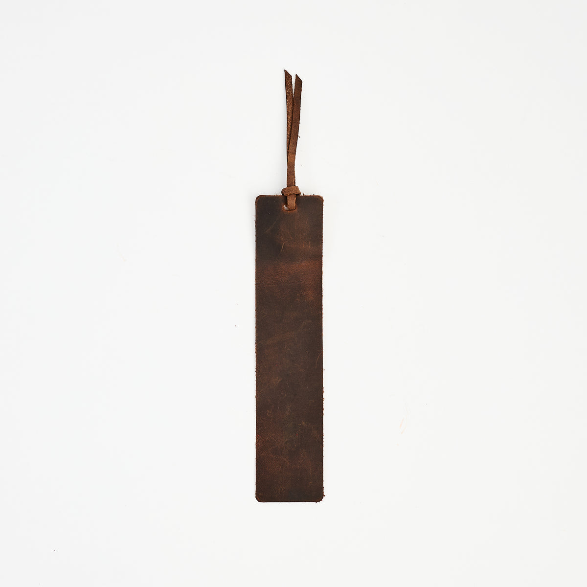 Genuine Leather Bookmark in Dark Brown on a white background at Addison West