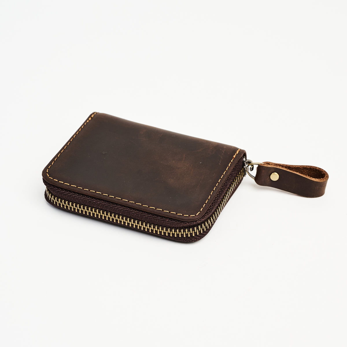 Zippered Small Leather Wallet in Dark Brown on a white background at Addison West