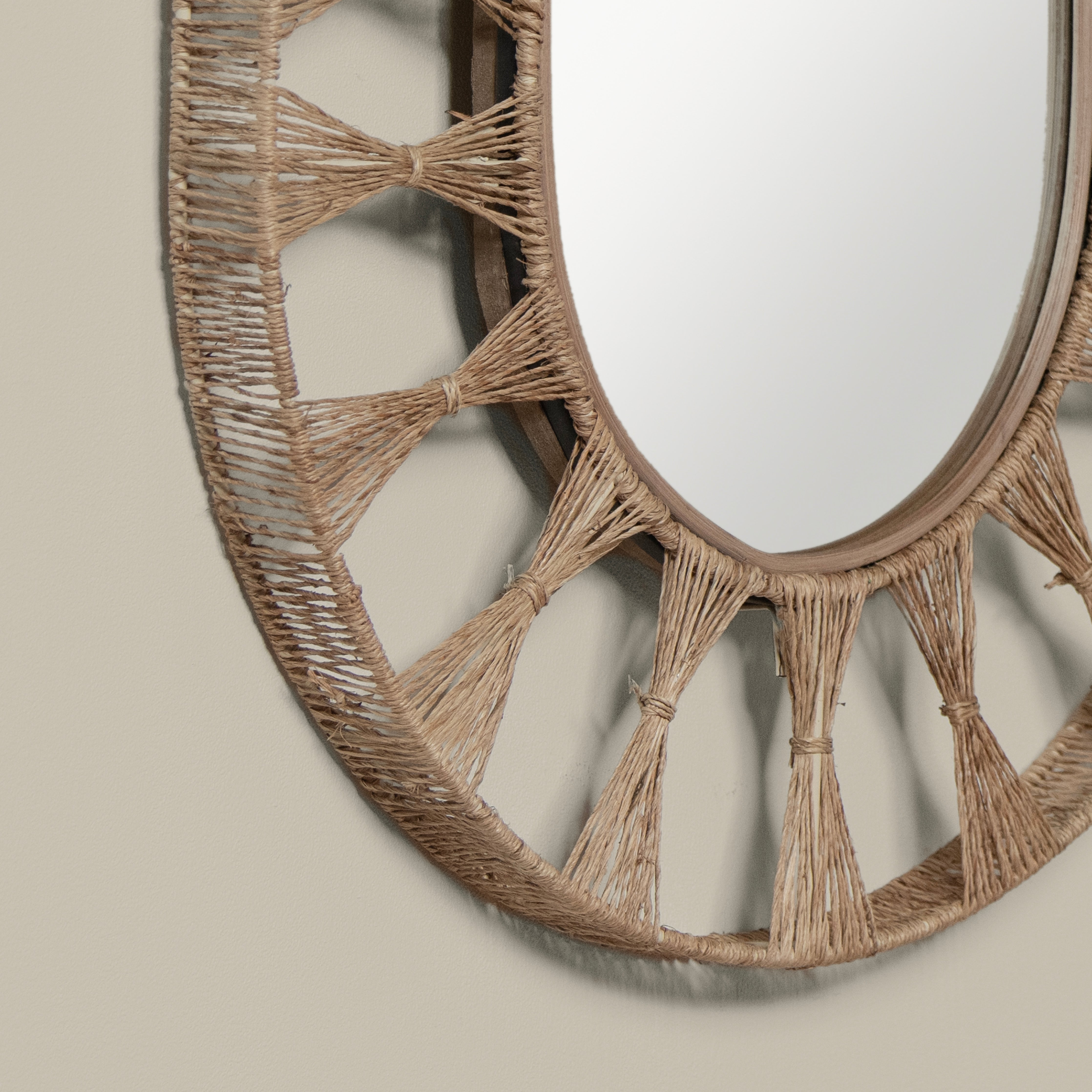 Close up of Ojai Oval Mirror on a beige background at Addison West