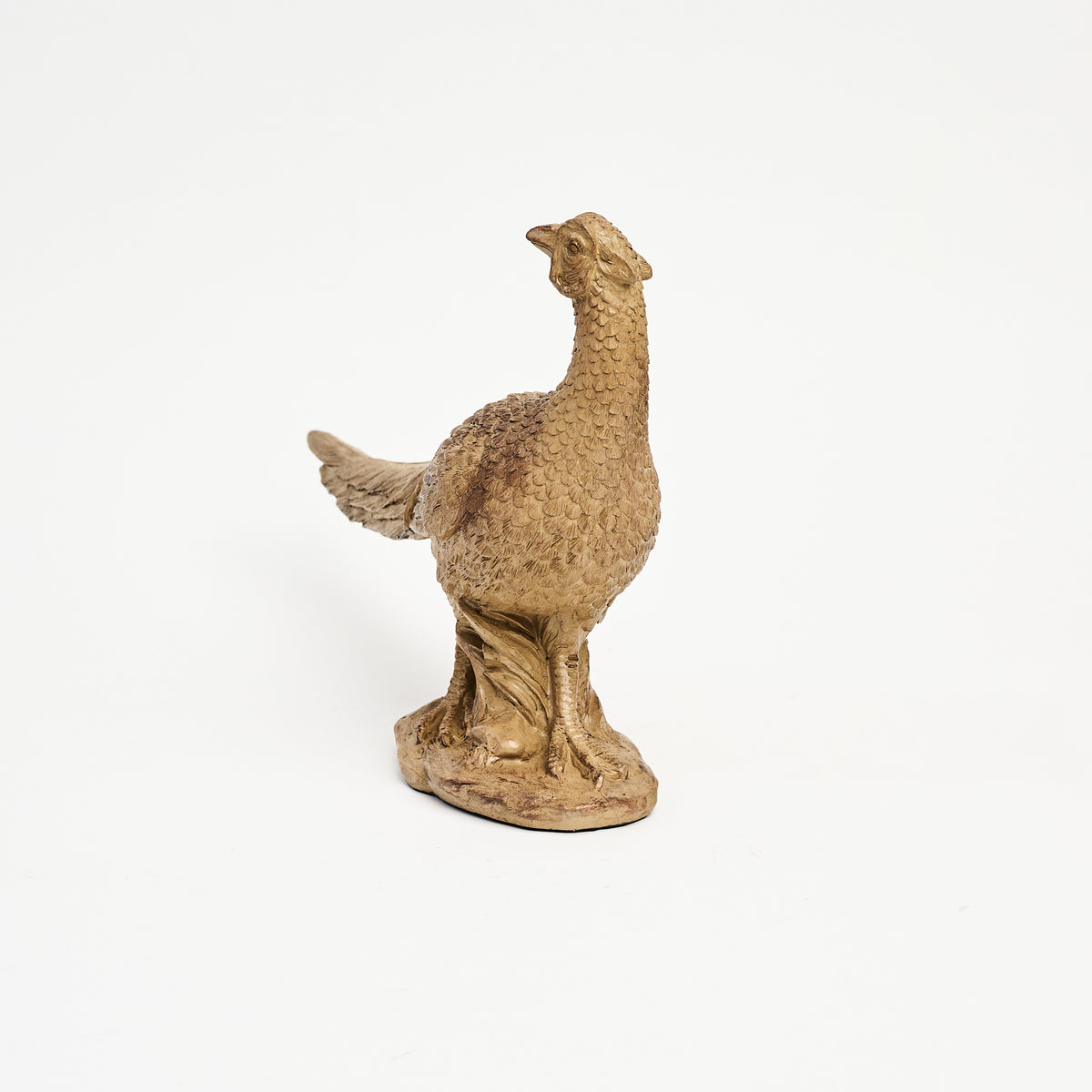 Female Pheasant Sculpture on a white background at Addison West