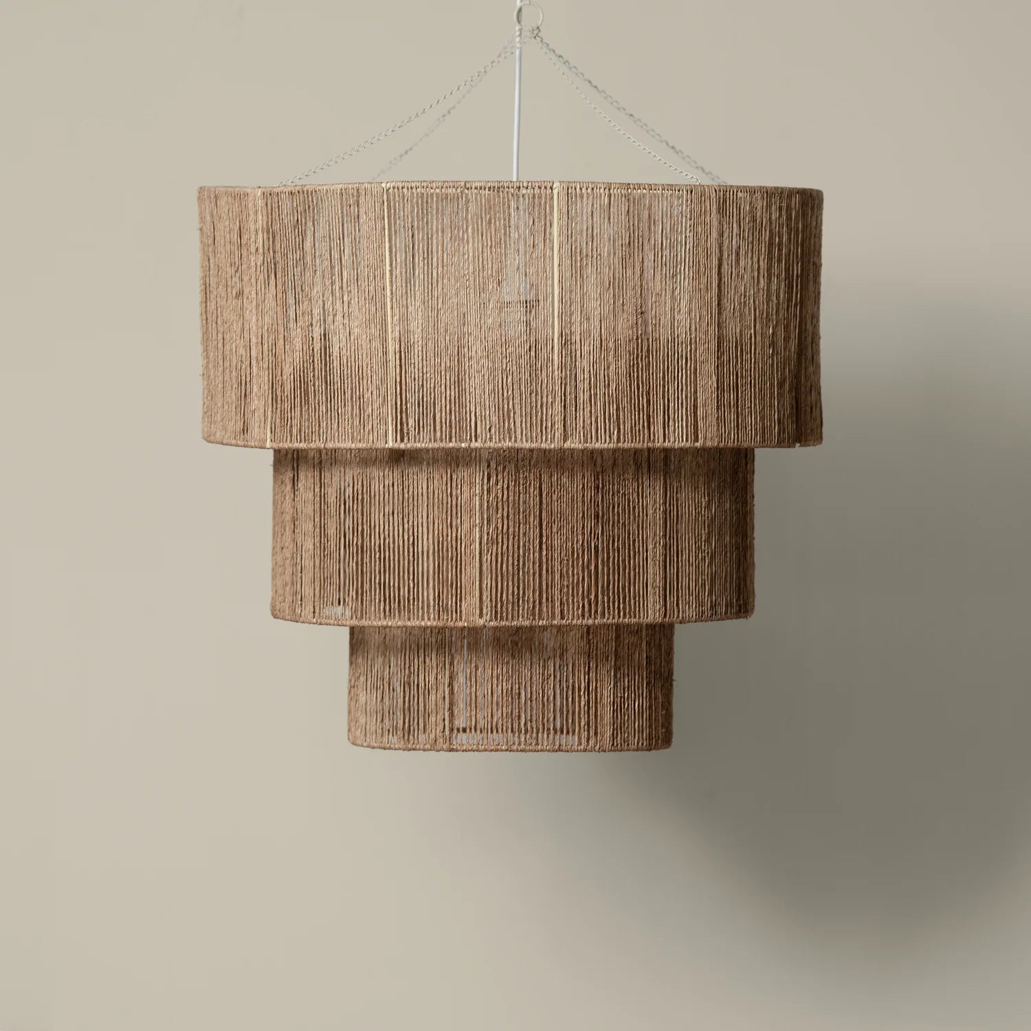 Woven brand 3 Tier Jute Chandelier on a beige background