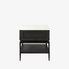 Square end table with black iron base, wood shelf and drawer and marble top on a white background