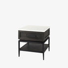 Square end table with black iron base, wood shelf and drawer and marble top on a white background