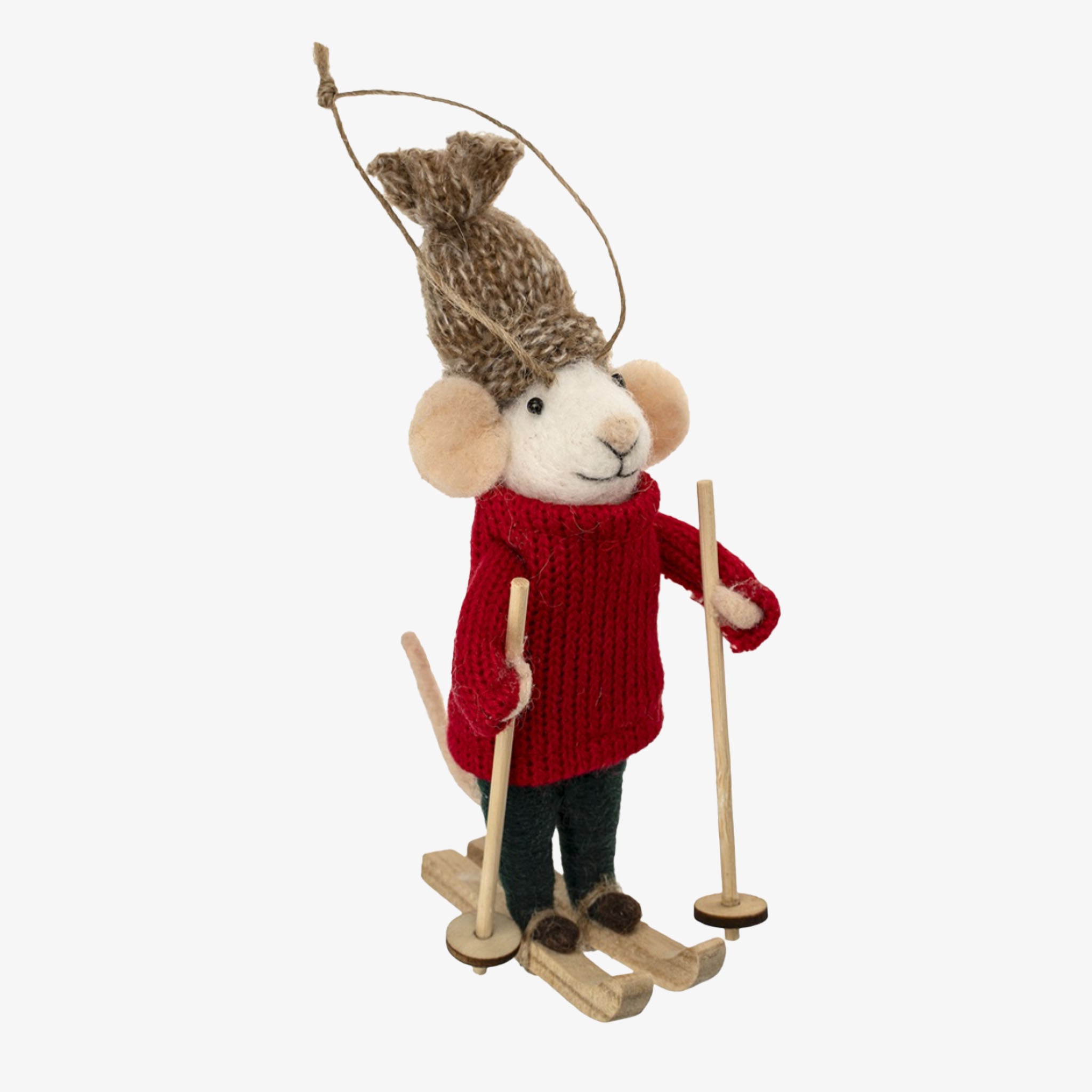Stuffed animal toy resembling a mouse in winter attire with a red sweater, brown hat, and skis on a white background.
