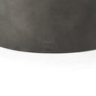 Close up of gunmetal top of nesting coffee table.