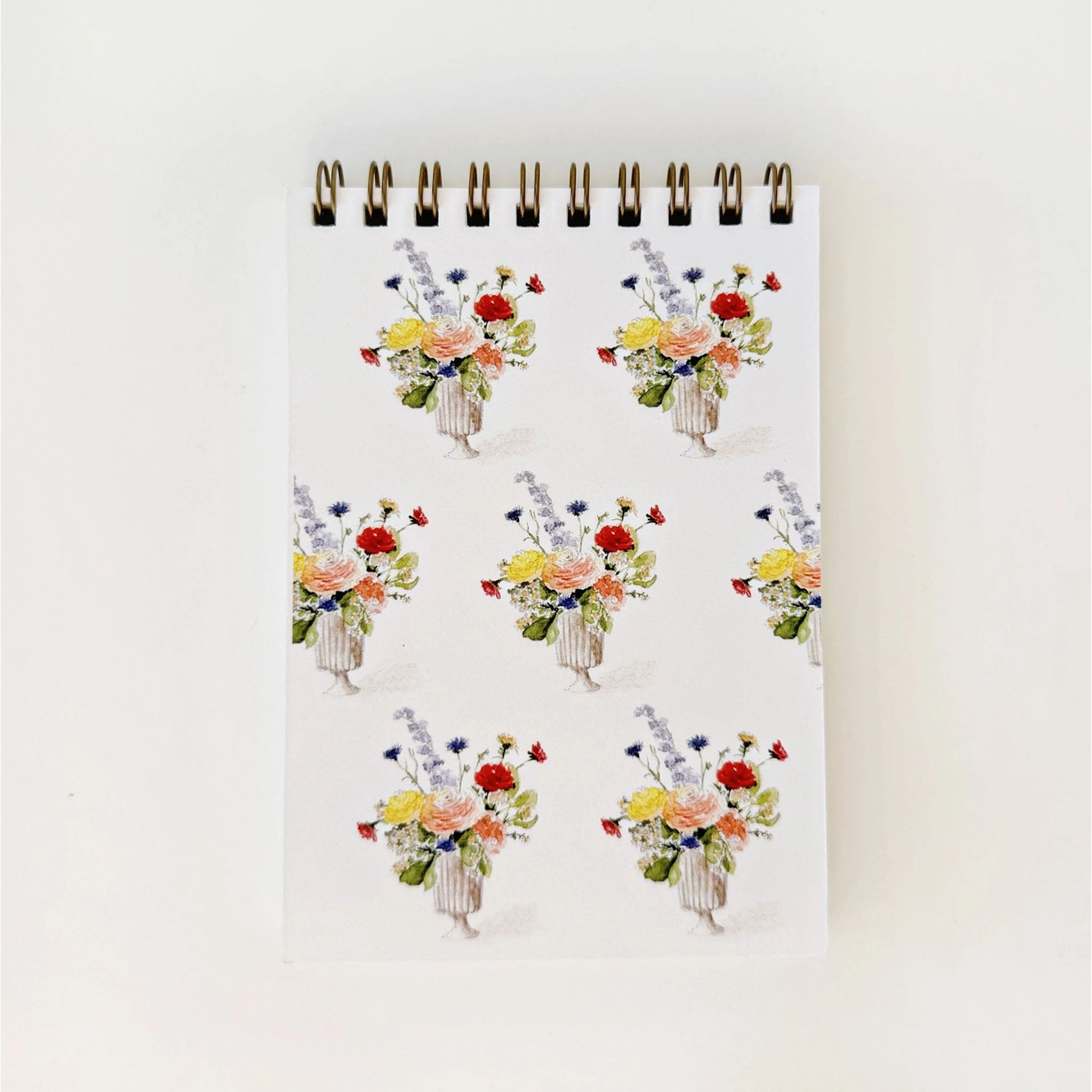 Notebook with floral design on a white background