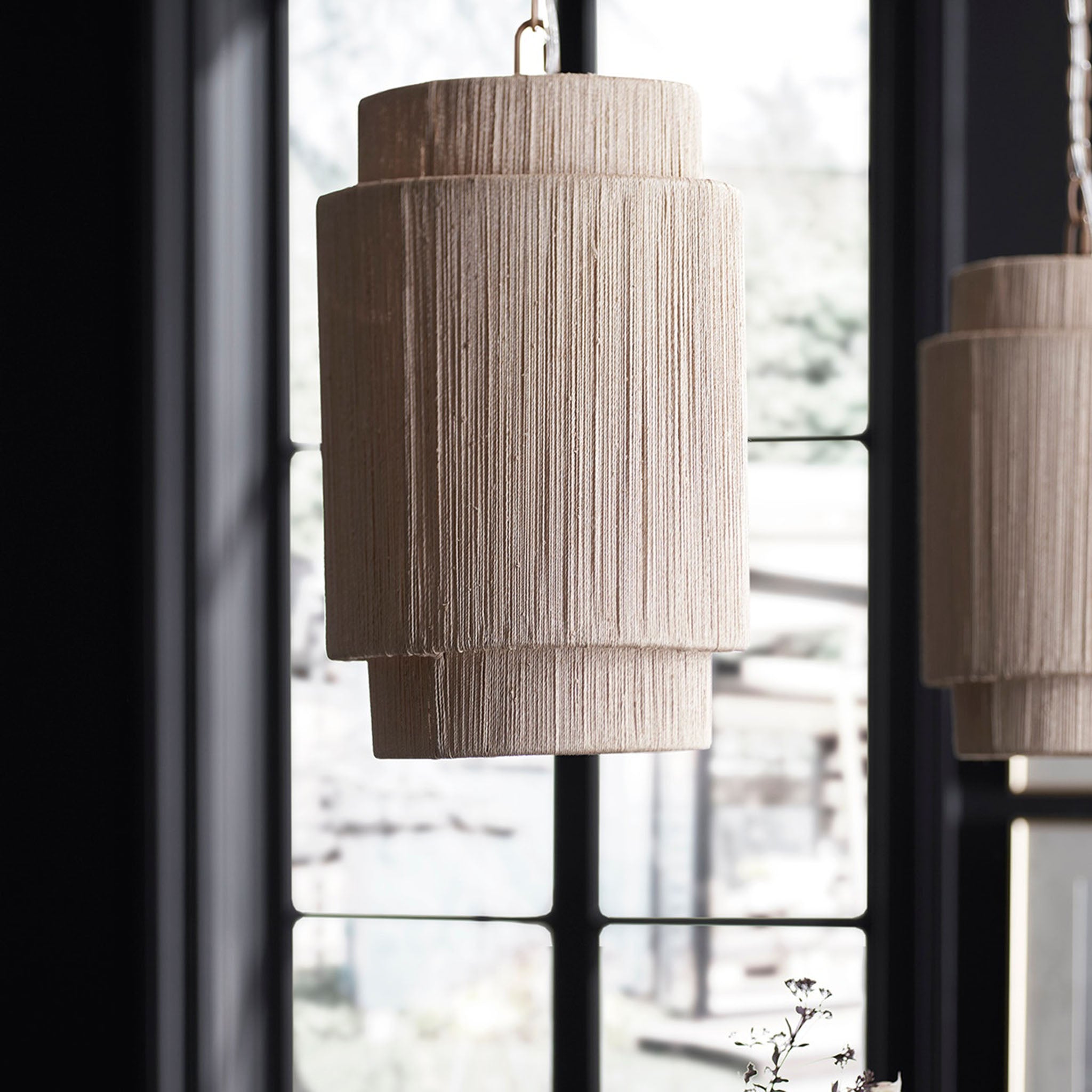 Everly Pendant in Natural, Small in a dining room at Addison West