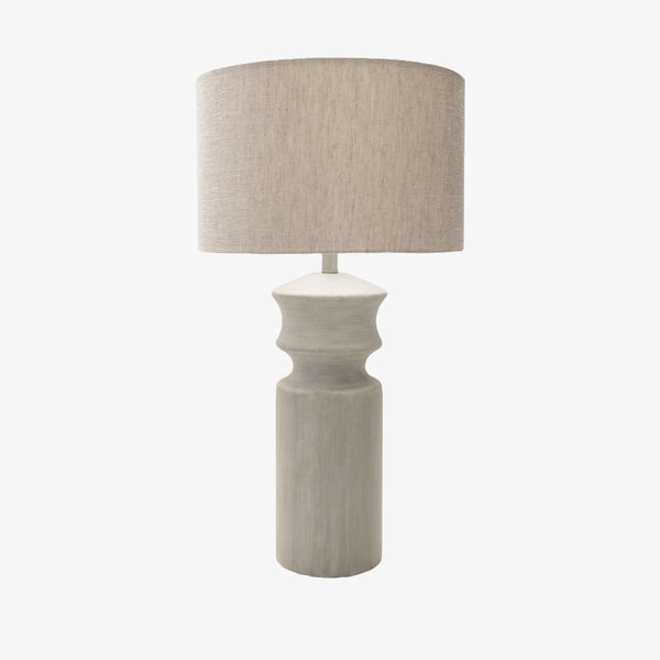 White hand finished lamp with neutral linen shade on a white background
