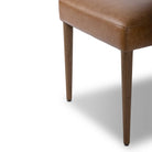 Close up of Four Hands Abilene Dining Chair in Chaps Saddle on a white background at Addison West
