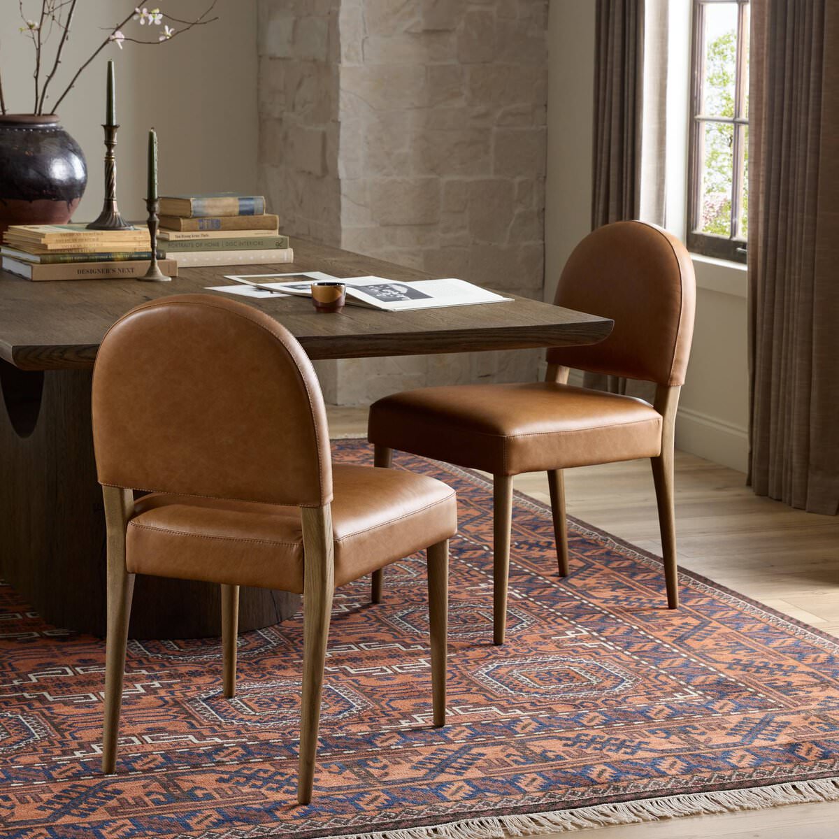 Four Hands Abilene Dining Chair in Chaps Saddle in a rustic dining room at Addison West