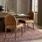 Four Hands Abilene Dining Chair in Chaps Saddle in a rustic dining room at Addison West