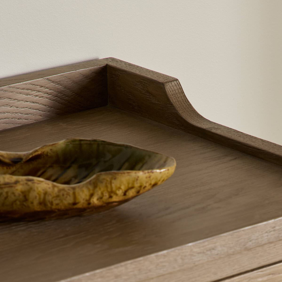 Close up of Four Hands Adley Sideboard in Weathered Washed Oak Veneer on a white background at Addison West