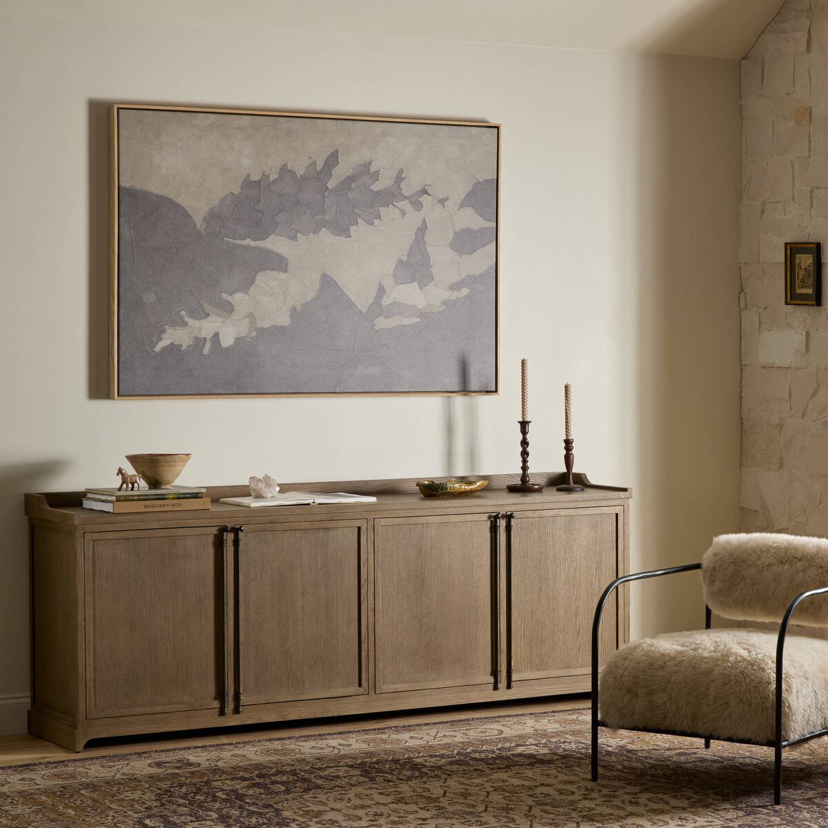Four Hands Adley Sideboard in Weathered Washed Oak Veneer in a neutral living room at Addison West