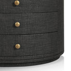 Close up of Four Hands Amelia Oval Nightstand in Black Linen on a white background at Addison West