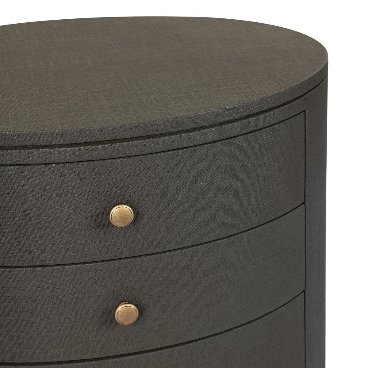 Close up of Four Hands Amelia Oval Nightstand in Dark Green Lacquered Linen on a white background at Addison West