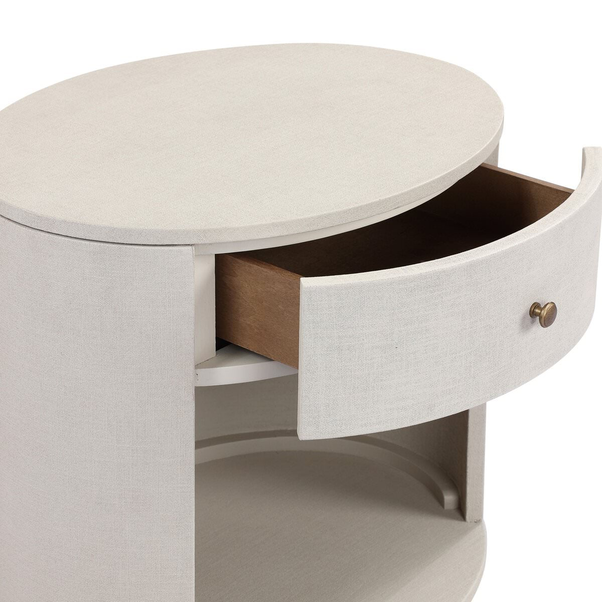 Close up of Four Hands Amelia Oval One Drawer Nightstand in Ivory Painted Linen on a white background at Addison West