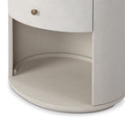 Close up of Four Hands Amelia Oval One Drawer Nightstand in Ivory Painted Linen on a white background at Addison West