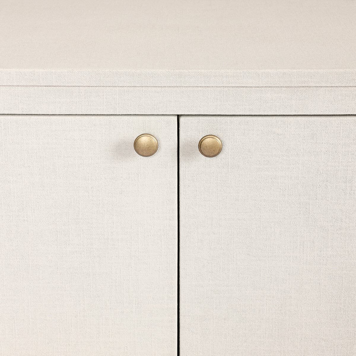 Close up of Four Hands Amelia Sideboard in Ivory Painted Linen on a white background at Addison West