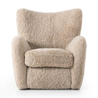 Four Hands Amelie Chair in Beige Shearling on a white background at Addison West