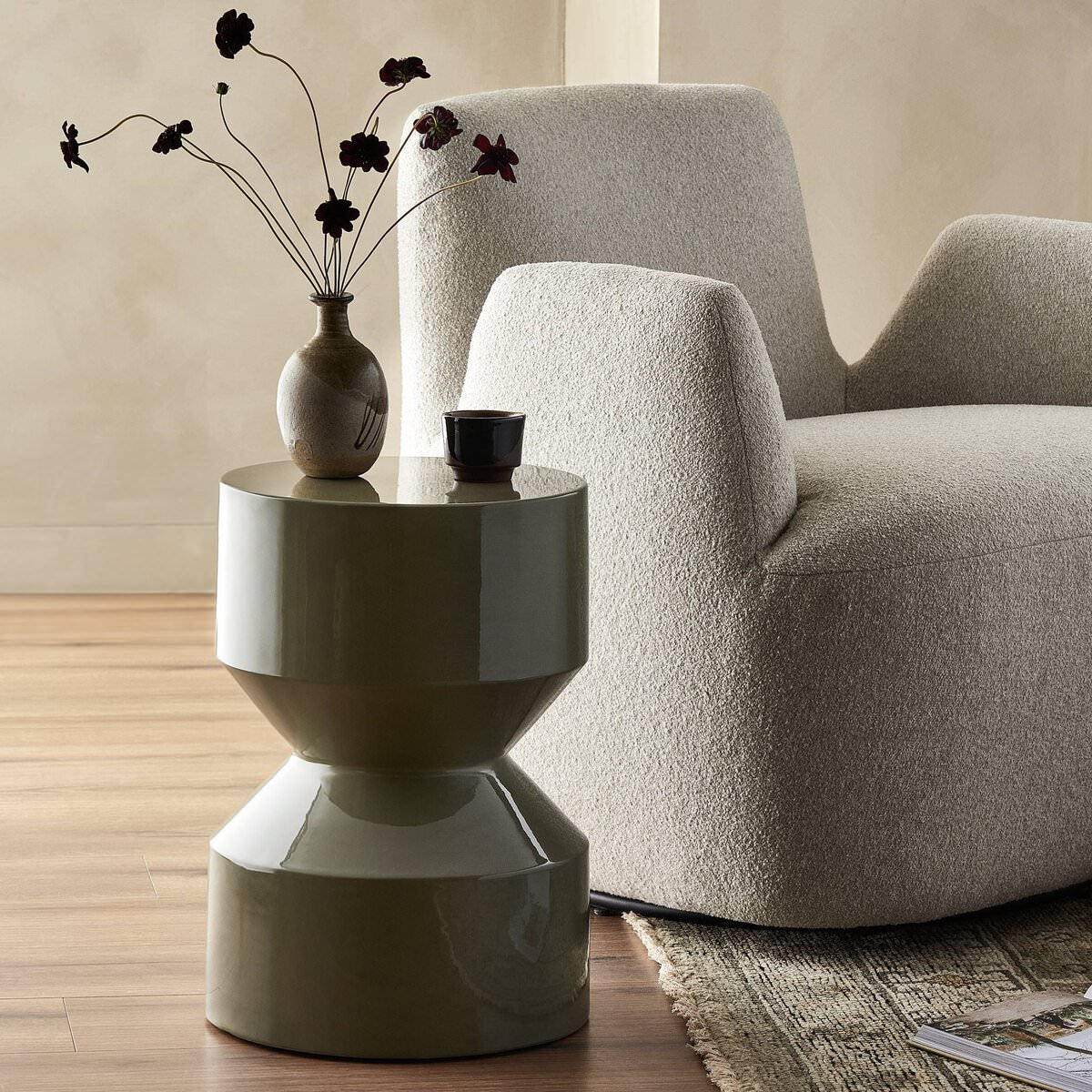 Four Hands Ara End Table in Moss Lacquered Concrete in a living room