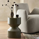 Four Hands Ara End Table in Moss Lacquered Concrete in a living room