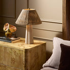 Four Hands Astra Table Lamp in Cream Italian Marble on a bedside table at Addison West