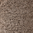 Close up of Four Hands Aurora Swivel Chair in Taupe Shearling on a white background at Addison West