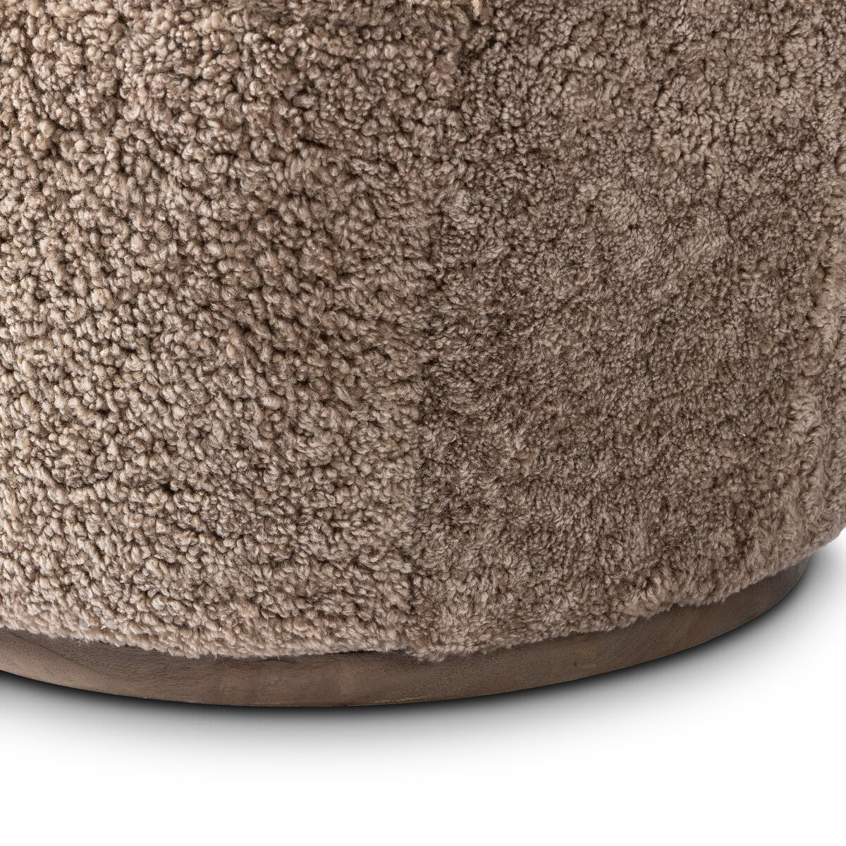 Close up of Four Hands Aurora Swivel Chair in Taupe Shearling on a white background at Addison West