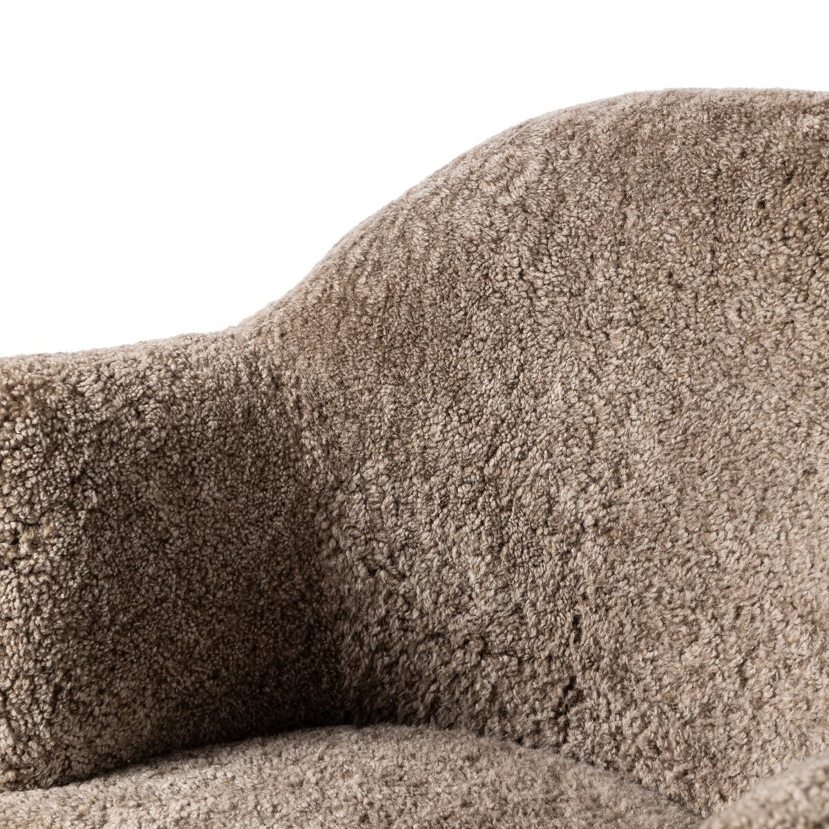 Close up of Four Hands Aurora Swivel Chair in Taupe Shearling on a white background at Addison West