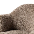 Close up of Four Hands Aurora Swivel Chair in Taupe Shearling on a white background at Addison West