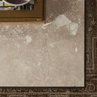 Top of Four Hands Babylon Coffee Table in Lunar Marble against a rug at Addison West