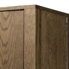 Close up of Four Hands Bedford Cabinet in Warm Natural Oak Veneer on a white background at Addison West