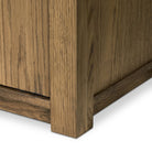 Close up of Four Hands Bedford Cabinet in Warm Natural Oak Veneer on a white background at Addison West