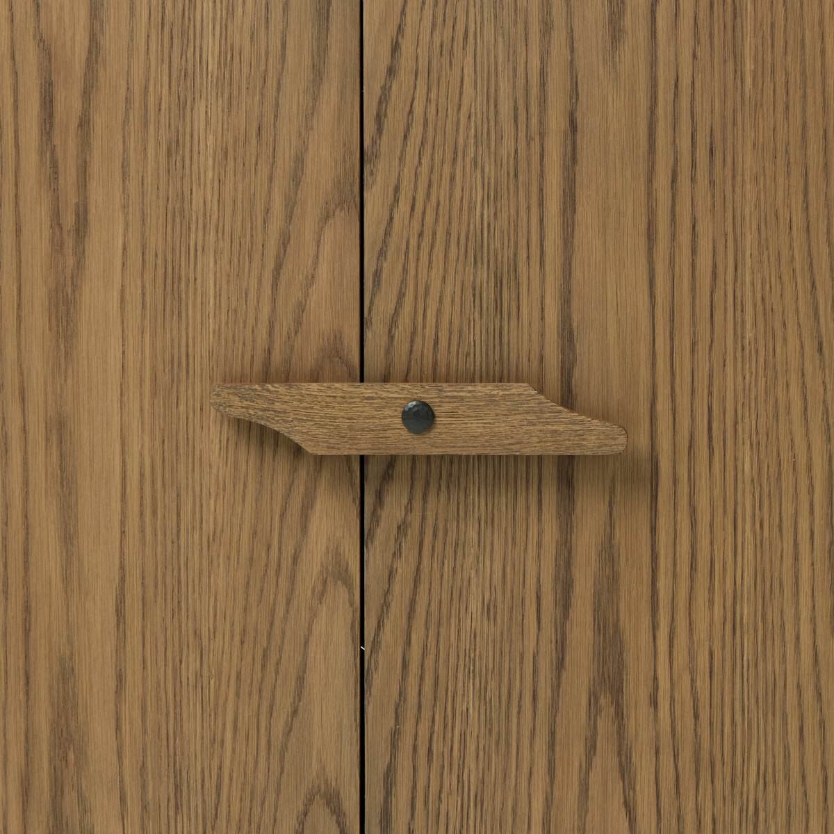 Close up of Four Hands Bedford Cabinet in Warm Natural Oak Veneer on a white background at Addison West