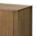 Close up of Four Hands Bedford Media Console in Warm Natural Oak Veneer on a white background at Addison West