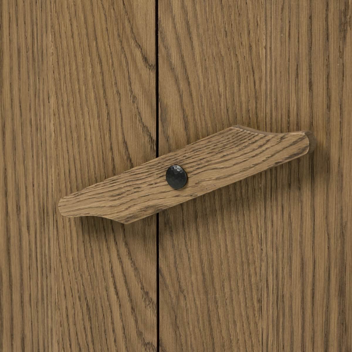 Close up of Four Hands Bedford Media Console in Warm Natural Oak Veneer on a white background at Addison West