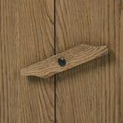 Close up of Four Hands Bedford Media Console in Warm Natural Oak Veneer on a white background at Addison West
