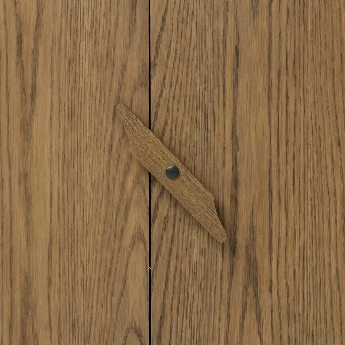 Close up of Four Hands Bedford Media Console in Warm Natural Oak Veneer on a white background at Addison West
