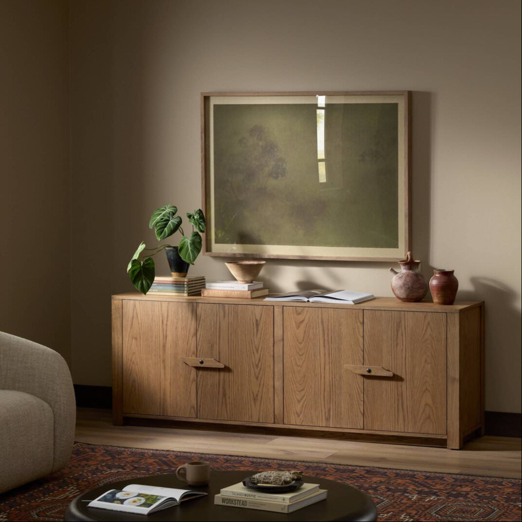 Four Hands Bedford Media Console in Warm Natural Oak Veneer in a living room at Addison West