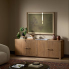 Four Hands Bedford Media Console in Warm Natural Oak Veneer in a living room at Addison West