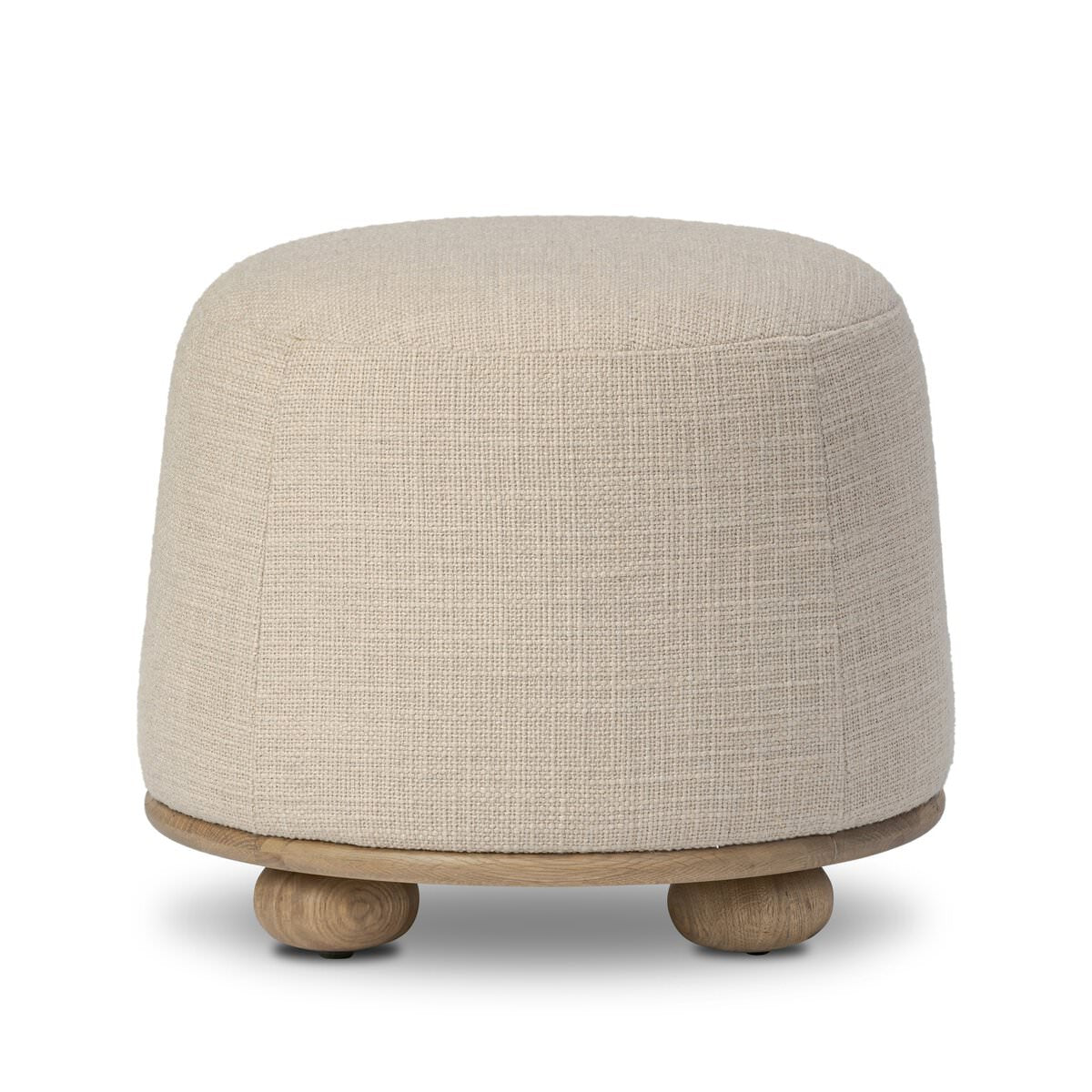Four Hands Bilbury Ottoman in Saxon Sand on a white background at Addison West