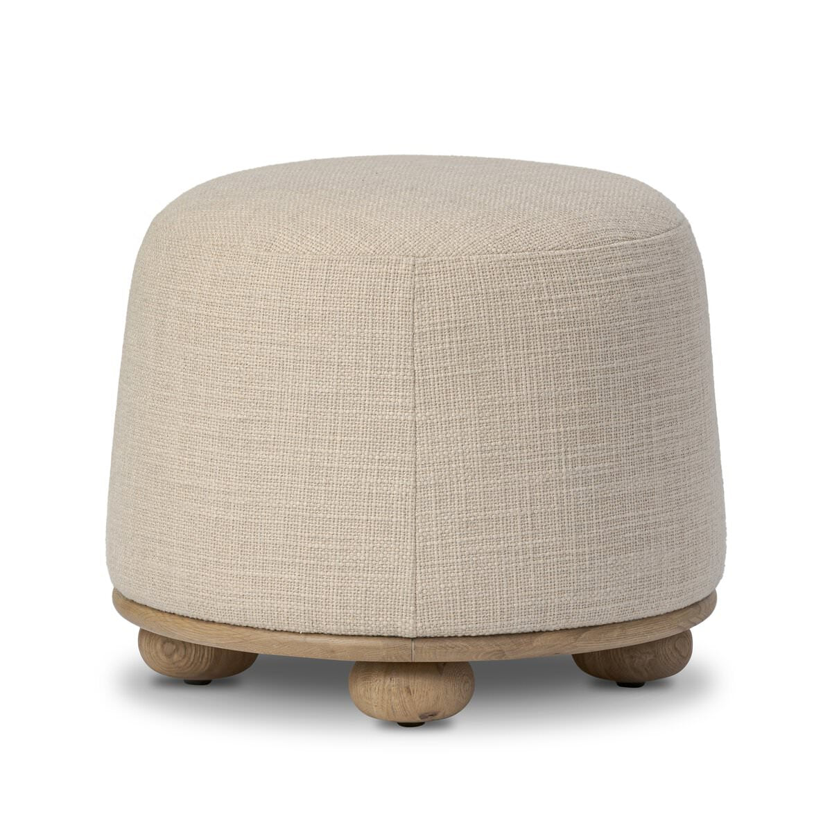 Four Hands Bilbury Ottoman in Saxon Sand on a white background at Addison West