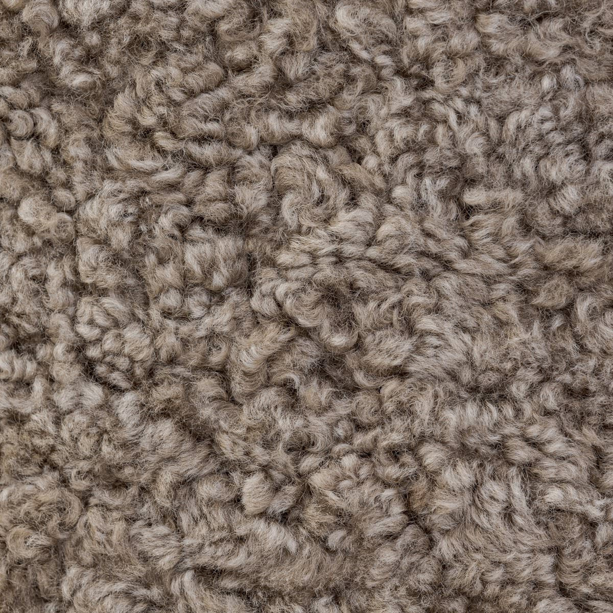 Close up of Four Hands Bilbury Ottoman in Taupe Shearling on a white background at Addison West