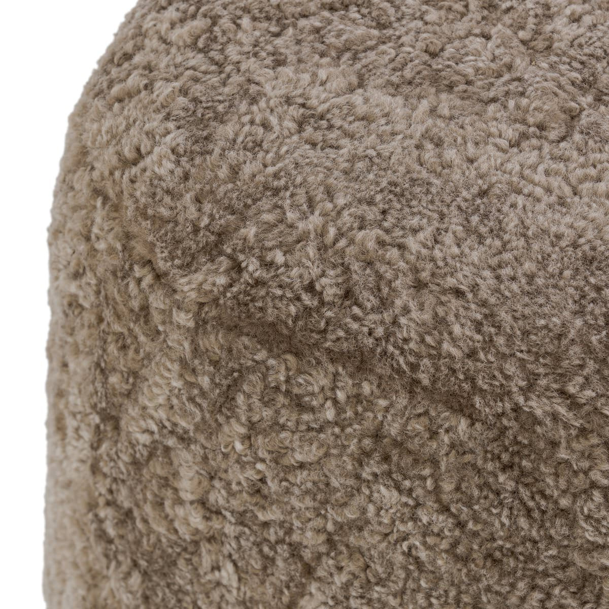 Close up of Four Hands Bilbury Ottoman in Taupe Shearling on a white background at Addison West