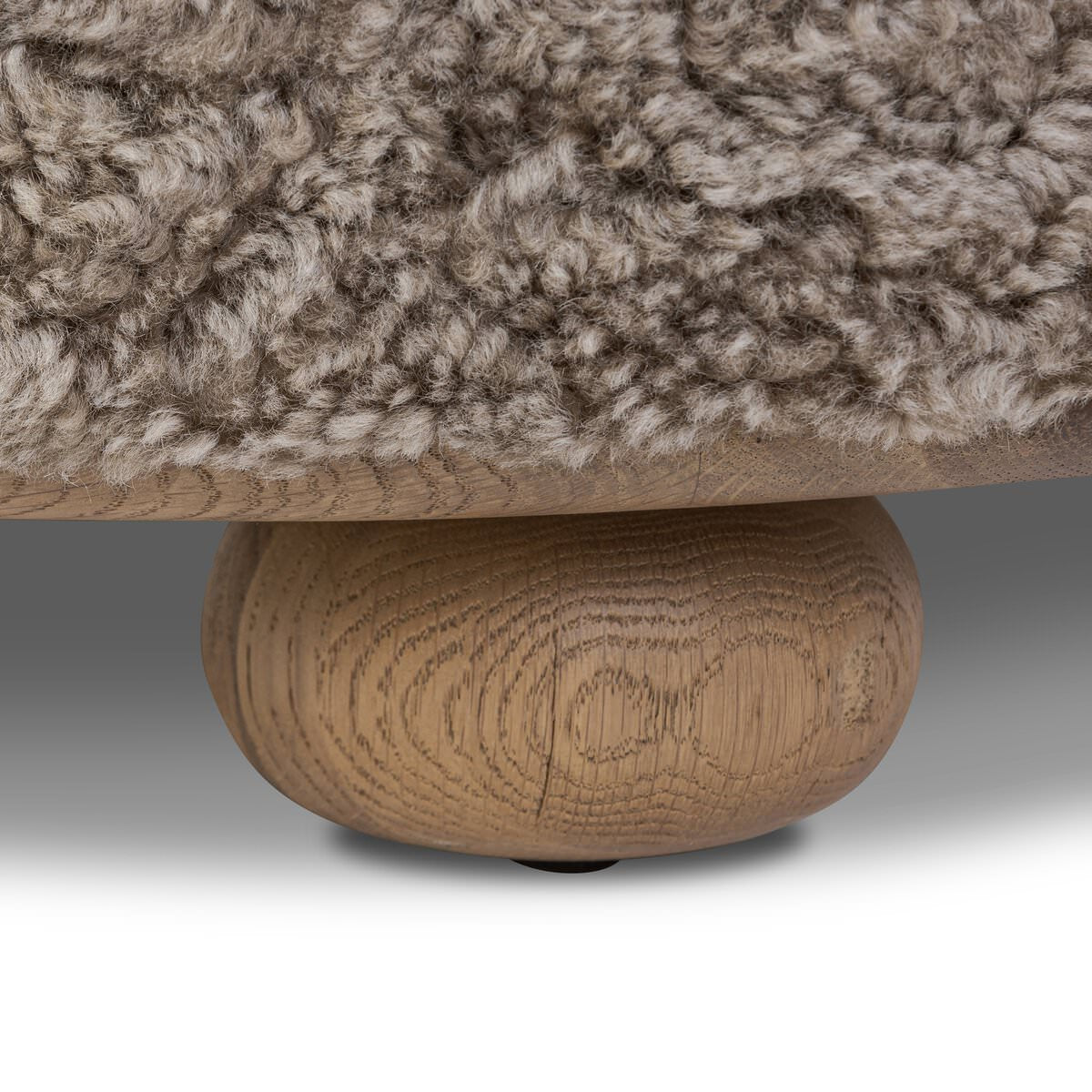 Close up of Four Hands Bilbury Ottoman in Taupe Shearling on a white background at Addison West