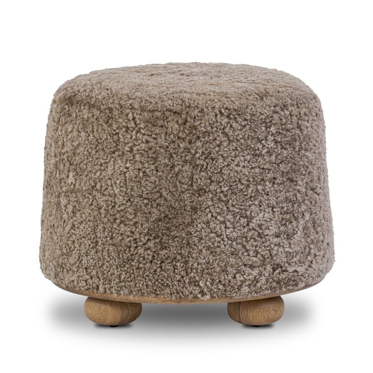 Four Hands Bilbury Ottoman in Taupe Shearling on a white background at Addison West