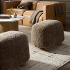 Four Hands Bilbury Oval Ottoman in Taupe Shearling in a neutral living room at Addison West