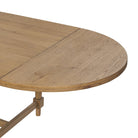 Close up of Four Hands Blinn Oval Leaf Extension Dining Table 88"-127" in Worn Oak Veneer on a white background at Addison West