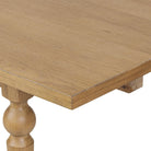 Close up of Four Hands Blinn Oval Leaf Extension Dining Table 88"-127" in Worn Oak Veneer on a white background at Addison West